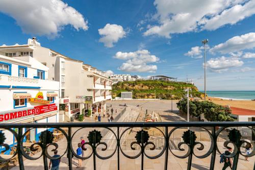 a view of a city from a balcony of a beach at Down Town Beach House in Albufeira