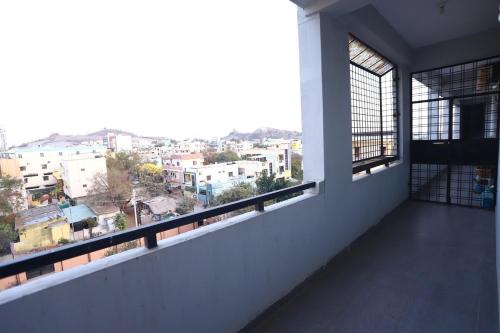 a balcony with a view of a city at Lalitha Residency in Secunderabad