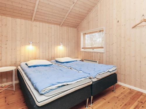 a bedroom with a large bed in a room at 6 person holiday home in Højby-By Traum in Højby