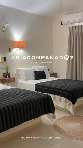 Postel nebo postele na pokoji v ubytování Casa Mango X Hotel Márquez de Santana
