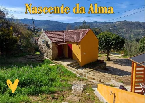 a small house in a village in the mountains at Nascente, place in nature next to a waterfall in Loureiro