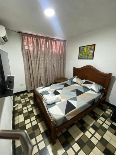 Postel nebo postele na pokoji v ubytování Hostal Familiar