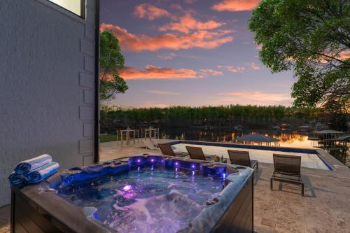a jacuzzi tub on a patio with a view at Salience Path in Mooresville