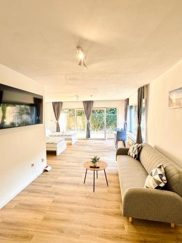 a living room with a couch and a table at Apartment 4you köln-Frechen in Frechen