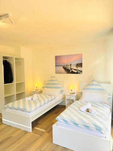 a bedroom with two beds and a pier at Apartment 4you köln-Frechen in Frechen