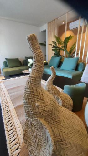 a living room with a sculpture of a cat on a rug at Contessa Suites in Lefkada Town