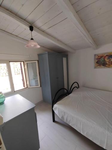 Postel nebo postele na pokoji v ubytování Casa vacanza Gargano "CASA MIMMA"