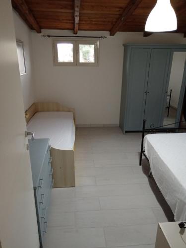 Postel nebo postele na pokoji v ubytování Casa vacanza Gargano "CASA MIMMA"
