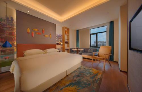 Postel nebo postele na pokoji v ubytování Manju Hotel Zhuzhou Tianyuan District Midea City Times Square