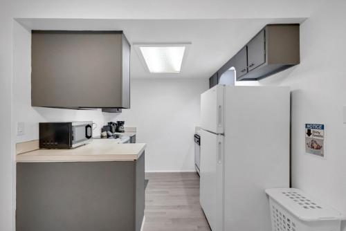 a kitchen with a refrigerator and a sink at Central Bellevue Retreat in Bellevue