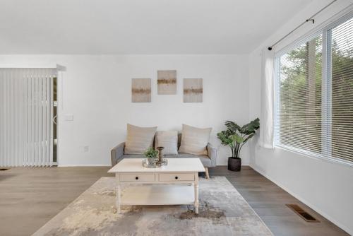 a living room with a couch and a table at Central Bellevue Retreat in Bellevue