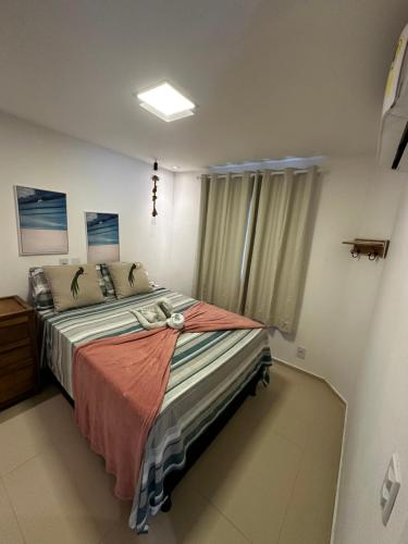 a bedroom with a large bed in a room at Casa em condomínio fechado in Barreirinhas