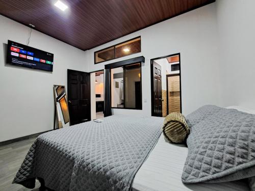 a bedroom with a large bed in a room at Isabella House, Beautiful views of the mountains in Matagalpa