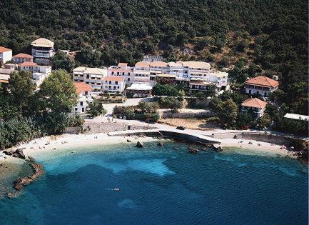 an aerial view of a beach with a resort at Savinos Rooms in Vasiliki