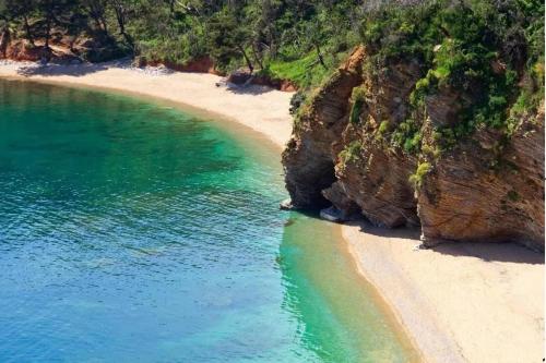 an aerial view of a beach next to a cliff at Horizon Two bedroom Penthouse with Hot tub in Becici
