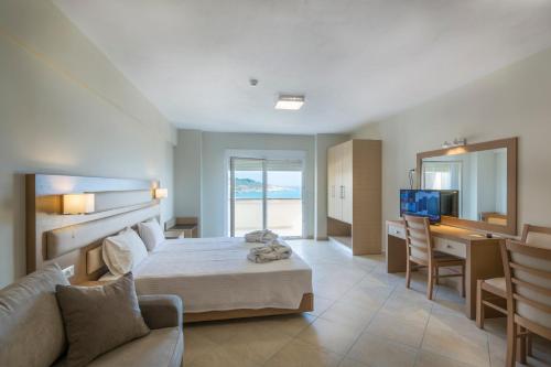 A bed or beds in a room at Sea View Resorts & Spa