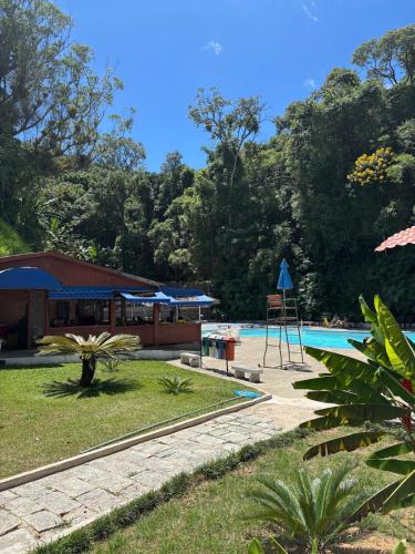 Πισίνα στο ή κοντά στο Loft a 10min do centro de Petrópolis