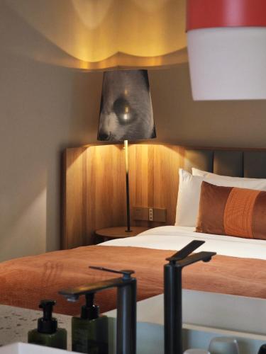 Postel nebo postele na pokoji v ubytování Panda Hotel