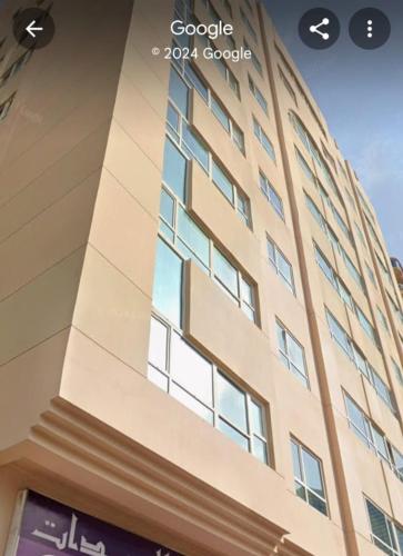 a view of the facade of a building at Delightful 3Bedroom Family Apartment with Garden View in Sharjah