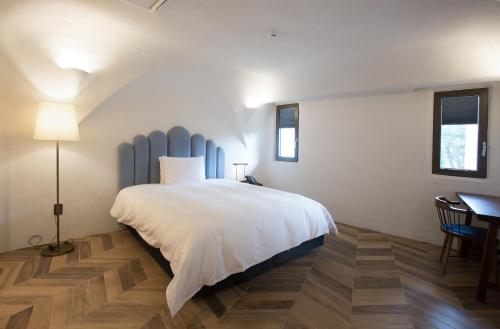 Ein Bett oder Betten in einem Zimmer der Unterkunft Ecoland Hotel