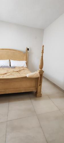 a bedroom with a bed in a white room at Vista al mar live in La Puntica de Juan Dolio