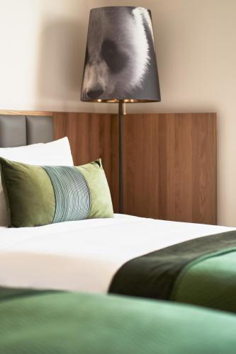 Postel nebo postele na pokoji v ubytování Panda Hotel