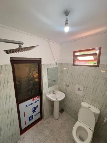 a bathroom with a toilet and a sink at Serenity stay Mirissa in Mirissa