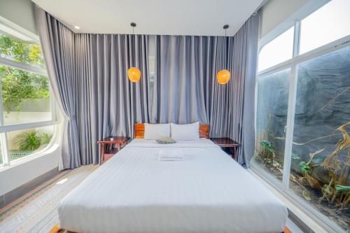 Katil atau katil-katil dalam bilik di Raing Phnom Bungalow