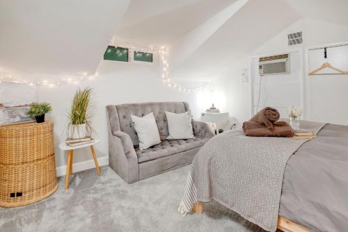 a bedroom with a bed with a teddy bear on it at Centrally Located Charming LA Home with Food Scenes in Monterey Park