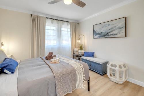 a bedroom with a bed with a teddy bear sitting on it at Centrally Located Charming LA Home with Food Scenes in Monterey Park