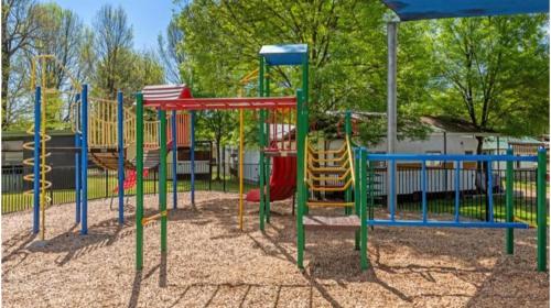 a park with a playground with a slide at Discovery Parks - Mount Buffalo in Porepunkah