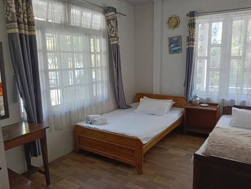Postel nebo postele na pokoji v ubytování Yuven House