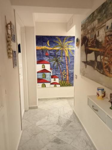 a hallway with a painting on the wall at Federico 70 Arabic Style in Palermo