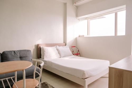 Ένα ή περισσότερα κρεβάτια σε δωμάτιο στο A Minimalist Cozy Escape