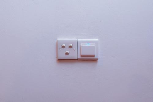 a white outlet on a white wall at Hilltop villas in Mirissa