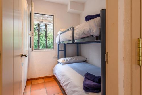 En eller flere senge i et værelse på Casa Llúcia - Check-out 1 pm I 3' playa I planta baja I céntrico I equipado