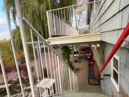 a staircase leading up to a house with a balcony at Blackbird Glen Bed and Breakfast, Glenmore, Kelowna, BC in Kelowna