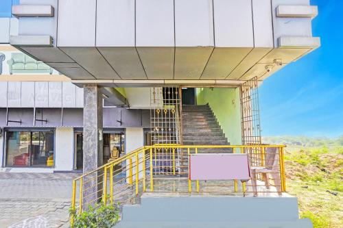 an external view of a building with a yellow railing at Hotel O Ranipet Vellore formerly Ars Residency in Pallikondai