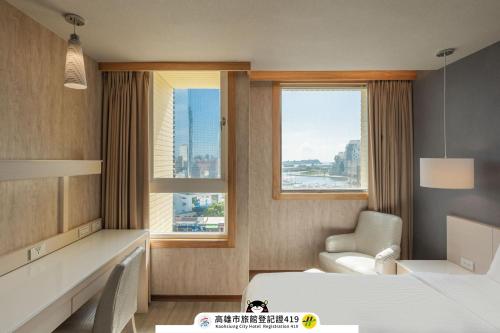 Postel nebo postele na pokoji v ubytování Kindness Hotel - Kaohsiung Guang Rong Pier