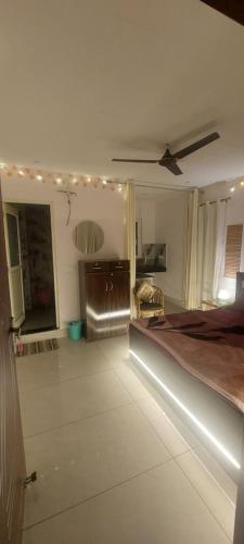 a bedroom with a bed with lights on it at SAMANI Homestay in Rishīkesh