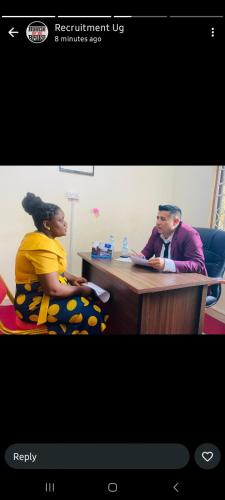 a man and a woman sitting at a table at Riyadh Barista Training School Nansana Uganda in Kampala