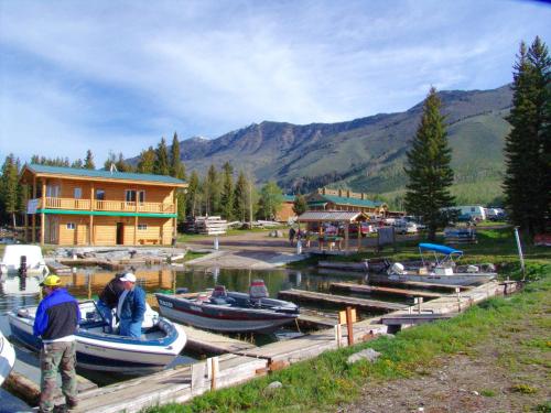 a group of boats are docked in a marina at Jared's Wild Rose Ranch Resort in Lake