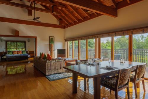 a large living room with a table and chairs at Sankara Hotel & Spa Yakushima in Yakushima