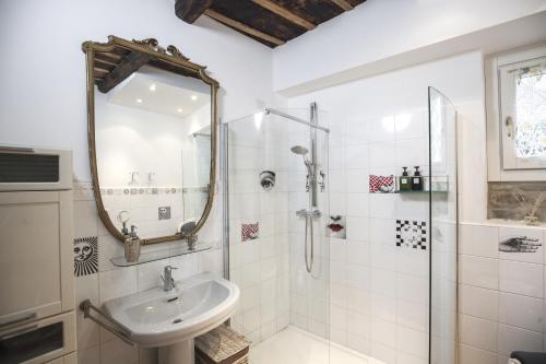 a bathroom with a shower and a sink at Porta Dipinta House Bergamo Alta in Bergamo