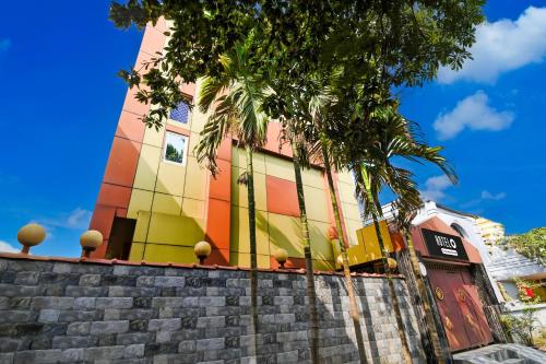 a colorful building on the side of a street at Super Hotel O Swaranpuri Near KIIT Square in Bhubaneshwar