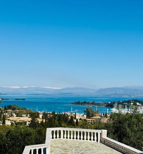 a view of the water from a building at La Vista Residence - 5 BDS, 2 private swimming pools, stunning sea views only 10 minutes from Corfu Town's Centre in Gouvia