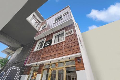 a tall building with windows on the side of it at Super Collection O Jammu Road Formerly Katra Retreat in Katra