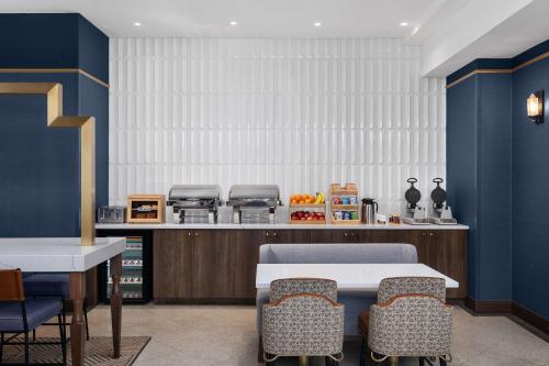 a dining room with a table and chairs at The Well House Hamilton, Tapestry Collection By Hilton in Hamilton
