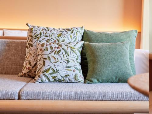 a group of pillows sitting on a couch at Dorsett by Agora Osaka Sakai in Sakai