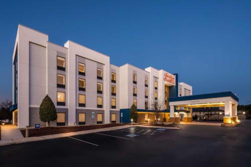 an empty parking lot in front of a hotel at Hampton Inn & Suites Wilson I-95 in Wilson